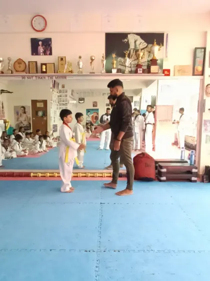 A handshake for a new yellow belt.
