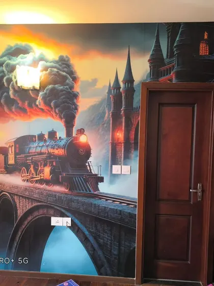 A dramatic, custom-printed mural of a fantasy steam train. This installation is perfect for a themed room, and my focus is on making the vibrant colors and details pop.