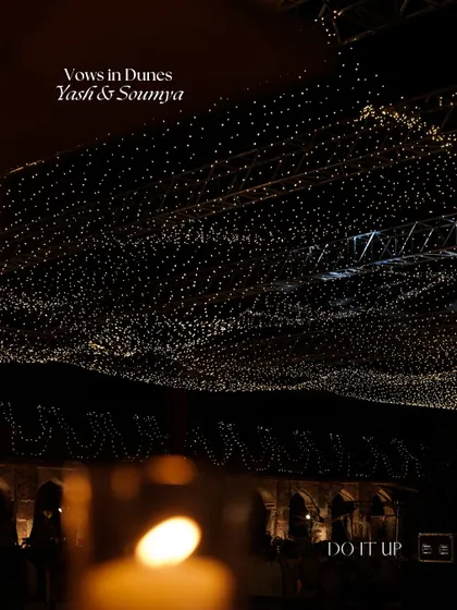 A night view of the Khimsar wedding, where the entire venue was lit up with a ceiling of fairy lights. This 'Vows in Dunes' setup created a celestial, starry-night effect.