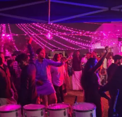The energy is high at this corporate Diwali party, with guests dancing and celebrating together.