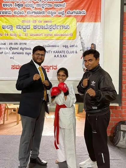 Here I am with Sara, who won Gold at the Under 17 District Level Championship. It's my honor to coach these strong young women and watch them become champions.