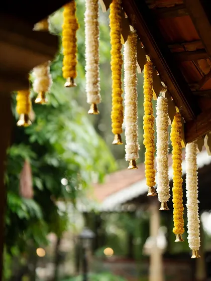 Eco-friendly elegance. These hanging garlands of marigolds and chrysanthemums are not only beautiful but also sustainable.