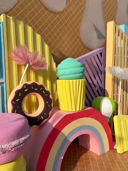 All things bright and sweet. This corner features giant donuts, cupcakes, and macarons, perfect for a summer celebration.