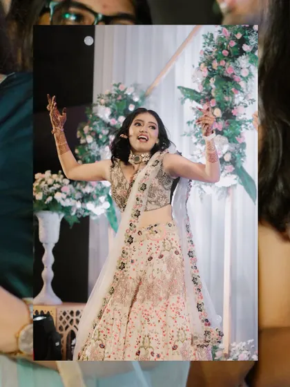A candid shot of the bride's energetic dance performance on stage.