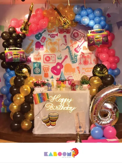 Let's rock and roll! This music-themed birthday party is perfect for a little rockstar, with guitars, drums, and a vibrant, energetic backdrop.