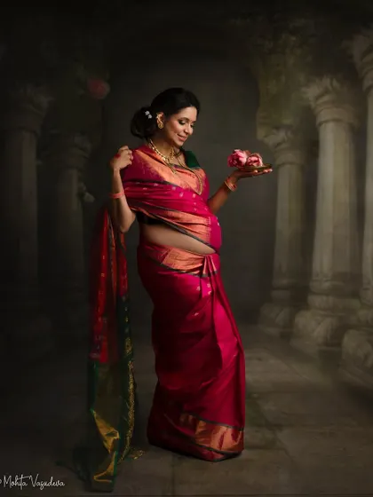 Another artistic composition from this traditional session, focusing on the details of the saree and the symbolic offering of flowers.