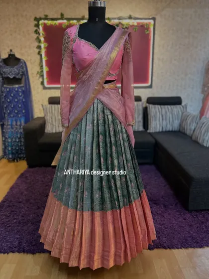 A beautiful pink and grey lehenga with sheer embroidered sleeves.
