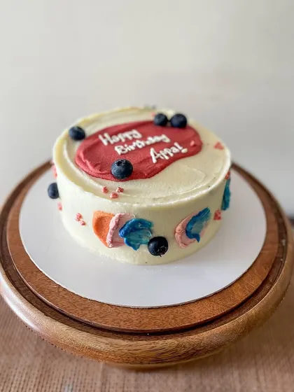 A simple and modern cake for Appa's birthday. This blueberry lemon curd cake is decorated with abstract buttercream swipes of color and fresh blueberries.