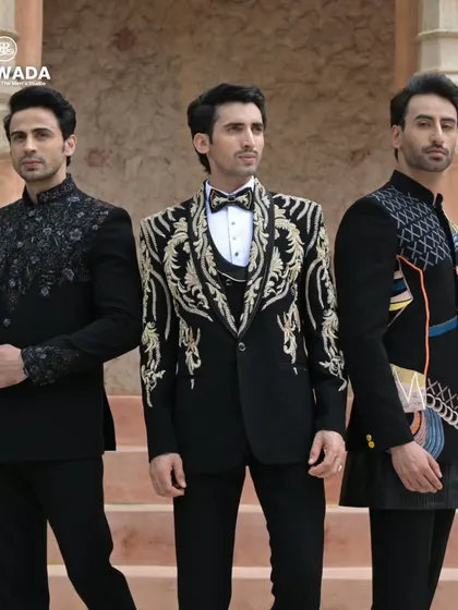 A closer group shot, highlighting the contrasting styles of the heavily embroidered tuxedo and the more subtly detailed bandhgalas.