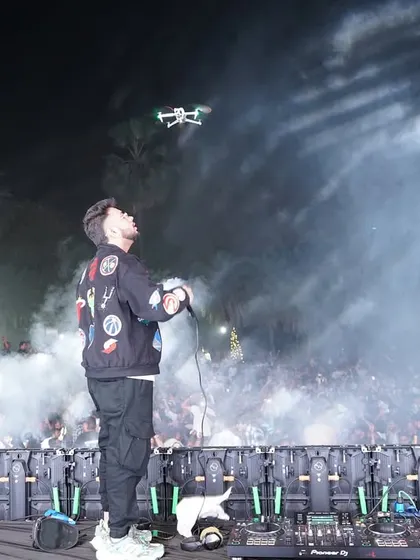 A cool shot capturing the drone flying overhead to film the show. We use everything to capture the best moments.