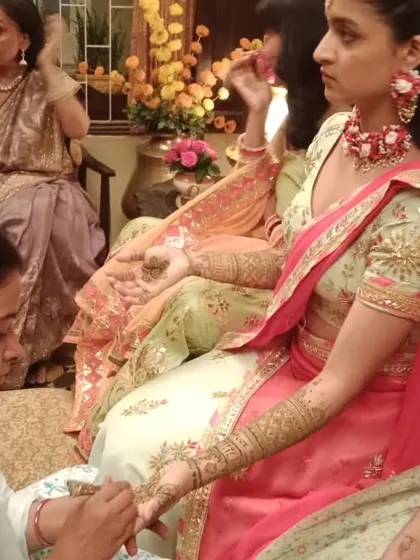 Applying mehendi for the actress, ensuring the design was perfect for the camera.