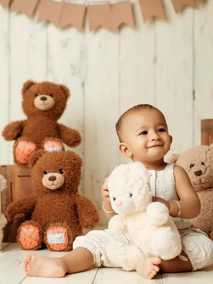 Who is the cutest teddy bear in the room? This classic teddy bear picnic theme is a timeless choice for a baby's milestone photoshoot.