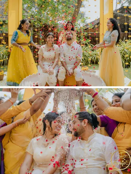 The couple sharing a beautiful moment amidst a shower of red and white petals during their Haldi ceremony.