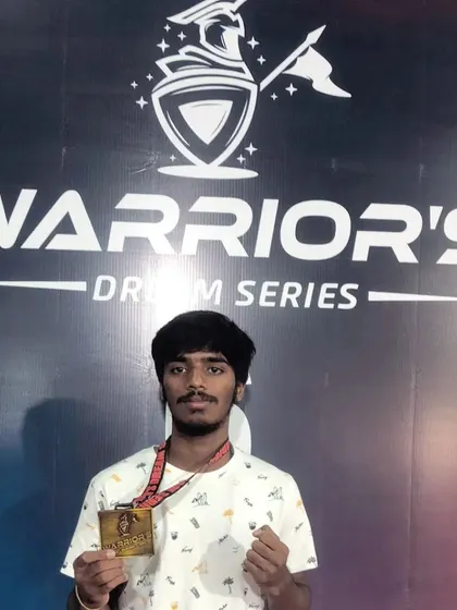 A debut fighter from our team proudly showing his gold medal from the Warrior's Dream Series. We guide new competitors to early success.