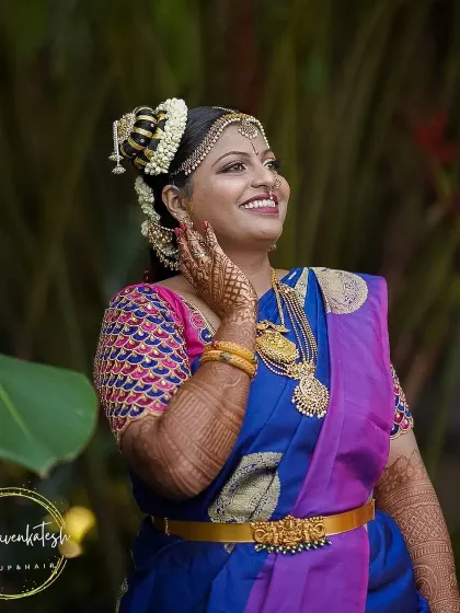 This Iyengar bridal look features the traditional 'kondai' hairstyle and authentic temple jewellery. My makeup artistry focuses on creating a divine look, reminiscent of the goddess Andal, which is central to this beautiful ceremony.