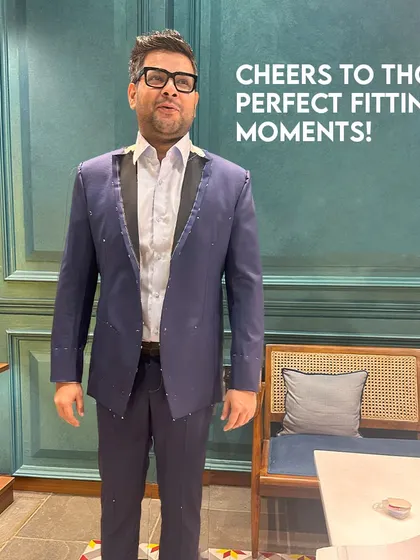Cheers to those perfect fitting moments! A client trying on his suit during a fitting at our studio, ensuring every detail is just right before the final stitches are made.