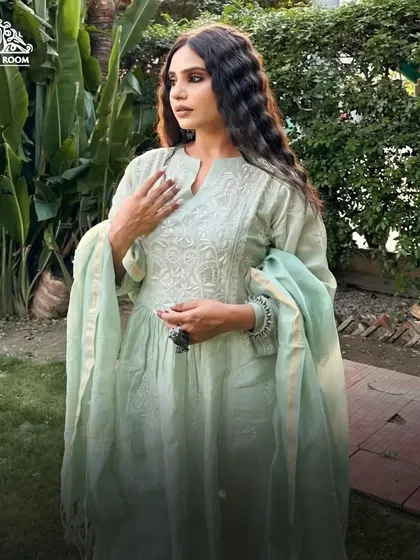 A lovely portrait in a garden setting. The makeup is fresh and light, perfect for an outdoor celebration or festive gathering.