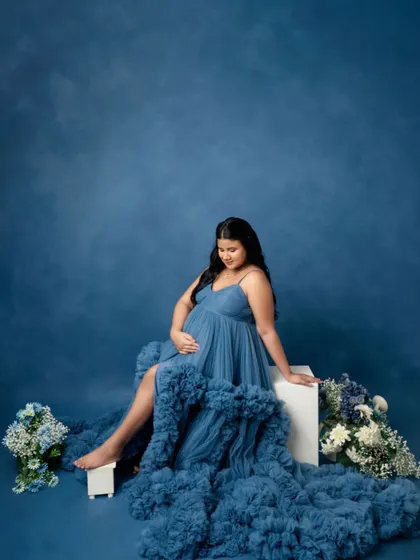 A solo portrait from the blue gown session, focusing on the incredible texture and flow of the dress.
