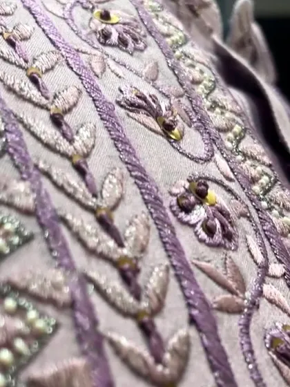 A detailed view of the delicate beadwork and thread embroidery that gives our festive collection its signature look.