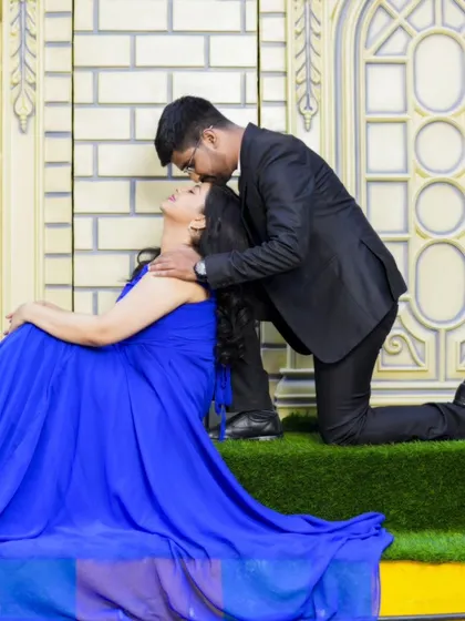 A tender moment with the groom-to-be kissing his partner's forehead. This classic pose is always full of emotion.