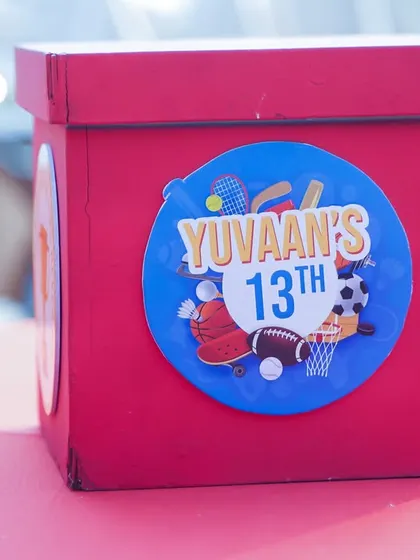 A custom centerpiece box for the 13th birthday sports party.