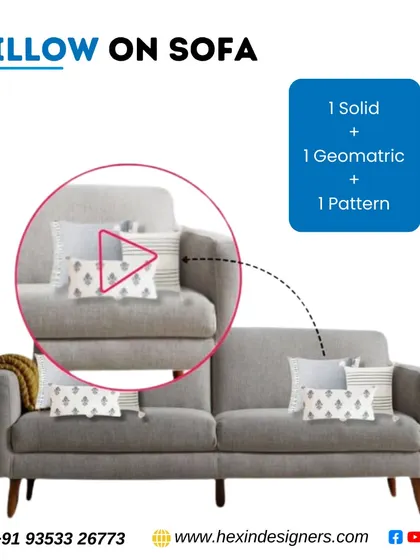 A simple tip for arranging pillows on a sofa is to use a mix of three types: one solid color, one with a geometric print, and one with a pattern. This creates a layered and professionally styled look.