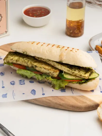 A closer look at the layers inside my Grilled Paneer Panini, showcasing the pesto-marinated paneer and crisp vegetables.
