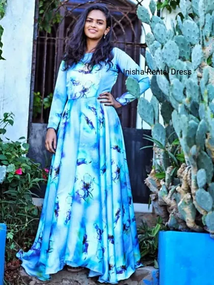 I also offer patterned options like this sky blue floral infinity gown. It's a unique and refreshing choice for an outdoor photoshoot.