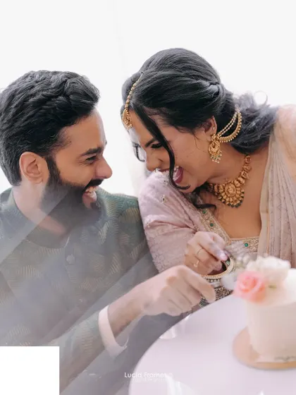A playful moment during an intimate cake-cutting ceremony, full of laughter and a little bit of frosting.