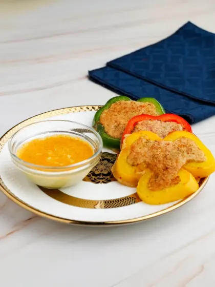 A healthy and elegant appetiser. We stuff colourful bell peppers with a savoury mixture of tofu and fresh vegetables, served with a flavourful dipping sauce on the side.