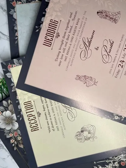 The complete suite for a modern, luxe wedding. The inserts continue the theme with a mix of blush pink and cream, beautifully framed by the dark floral border.