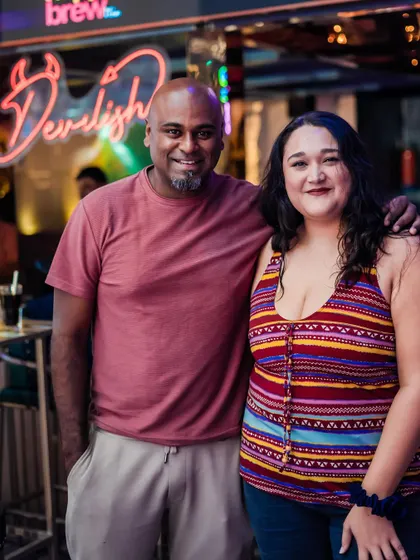 Posing with a guest outside the venue. I enjoy interacting with the crowd both inside and outside the club.