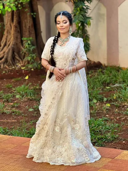 A full-length shot of the seamless white bridal look. This demonstrates how airbrush makeup is perfect for brides, as it provides a flawless finish that looks incredible in both close-ups and full-length photos.