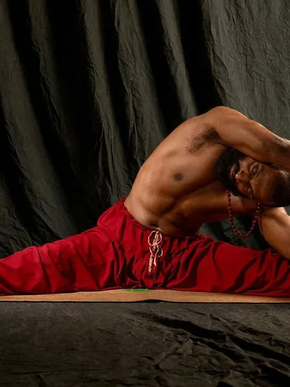 A deep seated side bend in Upavistha Konasana (Wide-Angled Seated Forward Bend). Flexibility is a process that requires patience. As you open your mind to the possibility, your body will gradually follow.