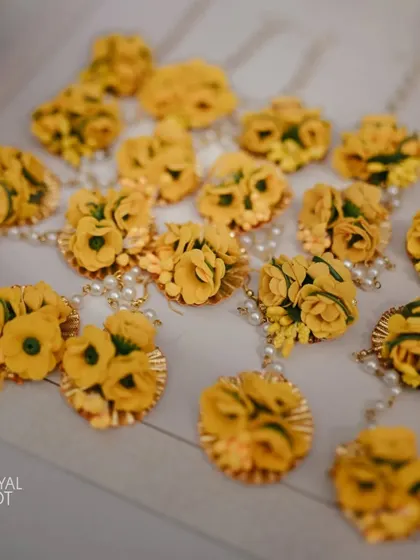 Beautiful floral bracelets made of yellow flowers, ready to be given to guests at the Haldi ceremony.