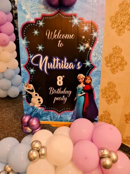 A close-up of the personalized welcome sign for Nuthika's 'Frozen' party.