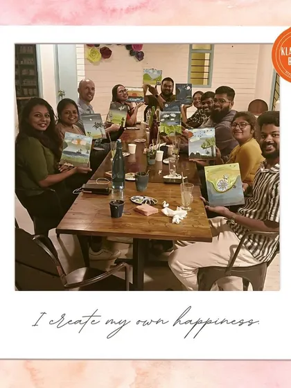 Another group photo from our "Canvas Carousel" event, with everyone proudly displaying their collaborative paintings.