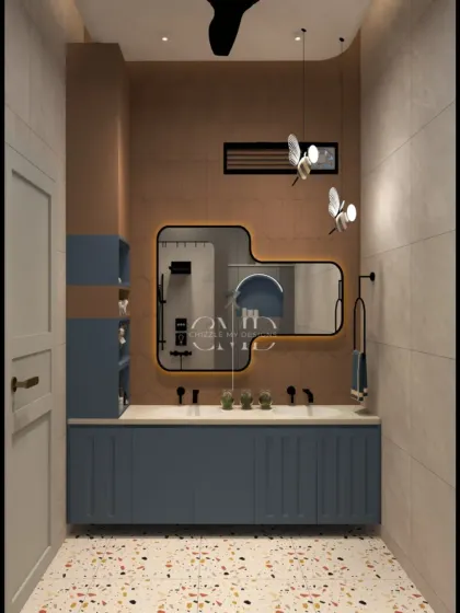 A playful yet sophisticated bathroom design with a blue double vanity, terrazzo flooring, and unique butterfly-shaped pendant lights.