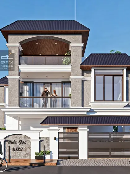 A series of images showcasing the "Veda Giri" residence, a beautiful traditional home design. The house features prominent columns, bay windows, and a distinctive sloped roof design, blending classical Indian elements with a modern sensibility.