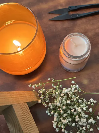 An aesthetic shot of my candles, showing different jar sizes and some of my crafting tools.