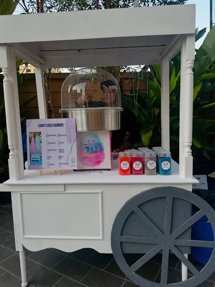 Clean, elegant, and ready for any occasion. Our classic white wheeled cart for cotton candy can be customized to fit perfectly with your party's theme and decor.