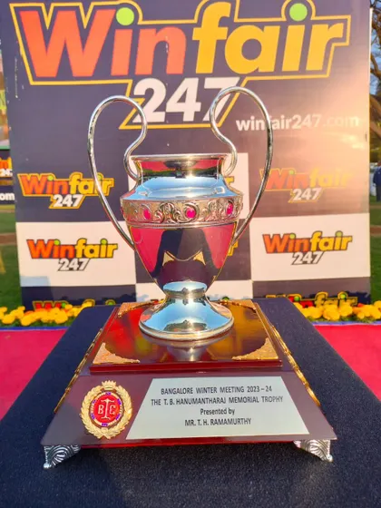 The T.B. Hanumantharaj Memorial Trophy, a classic silver cup with a distinctive shape.