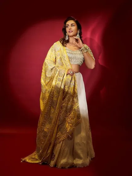 A radiant look for Dussehra. I styled Huma Qureshi in this beautiful ivory and gold lehenga by Faabiiana, with a heavily embroidered yellow dupatta that adds a festive pop of color.