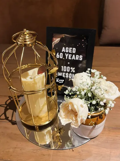 'Aged 60 years, 100% awesome'. These custom signs added a fun and personal touch to the table decor.