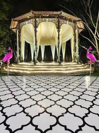 We brought a touch of whimsical grandeur to this sangeet with two magnificent pink peacock props. These custom-designed pieces with floral tails flanked the stage, creating a truly unique and memorable focal point.