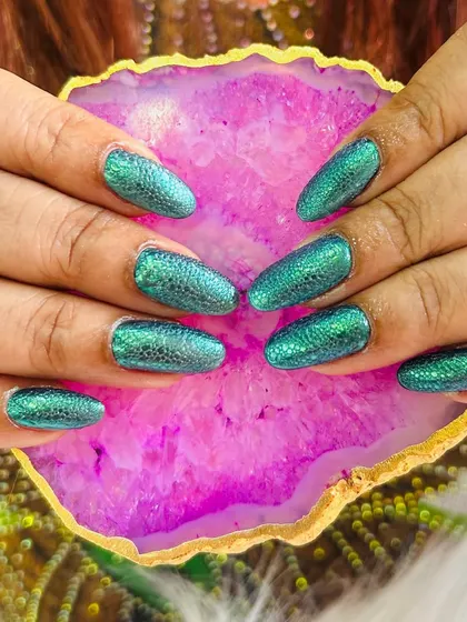 This design showcases a vibrant green snakeskin texture created with a special bubble technique over a metallic base. The result is a shimmering, reptilian effect that is both edgy and eye-catching.