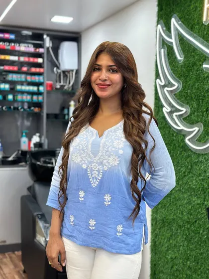A happy client showing off her new, healthy, no bleach color.