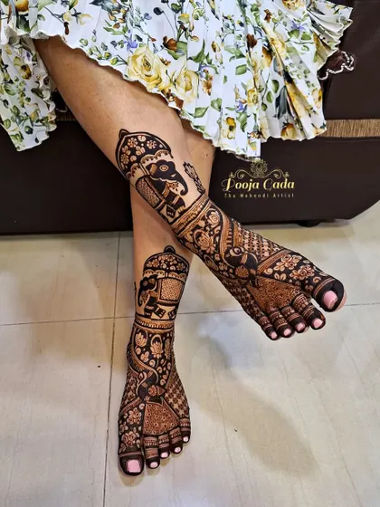 We make sure the henna artistry extends from head to toe. This is an example of our intricate bridal-style leg henna, featuring majestic elephants in a palanquin, creating a complete and royal look for any special occasion.