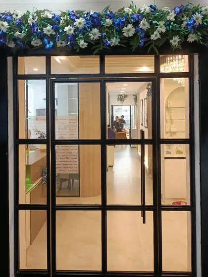 The entrance to our new Vasundhara clinic, adorned with flowers for our opening. We are ready to welcome you to a transformative experience.