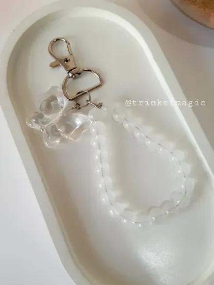 For a more classic and elegant look, I offer the beaded butterfly charm in a clear, iridescent style that catches the light beautifully.